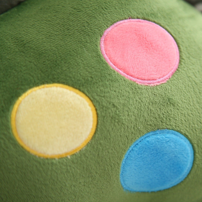 Whimsical dino plush toy, side view